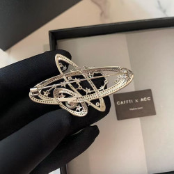 Women's Saturn star pearl suit brooch